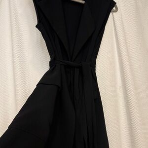 Black mid length you can put over anything very versatile or wear alone.